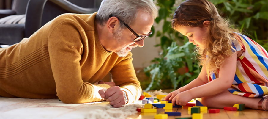 A person and child playing with blocks.