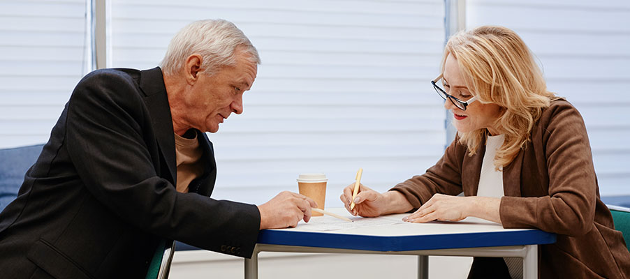 A person and person sitting at a table